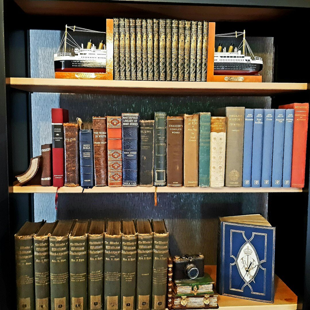 Portrait of a thoughtful Croatian male author near a bookshelf
