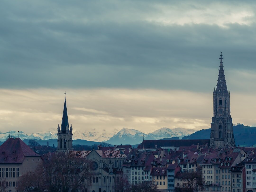 European old town skyline at dusk with a cathedral spire